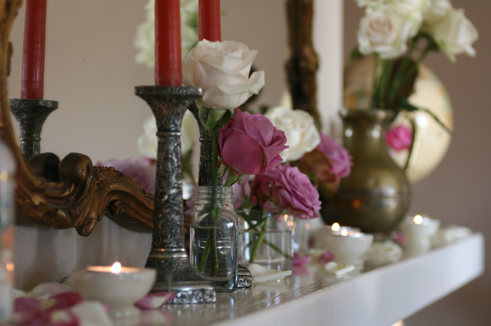 Candles and flowers on a hearth