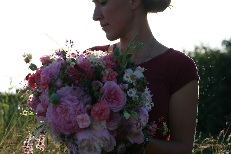 Erin Benzakein holding a seasonal bouquet