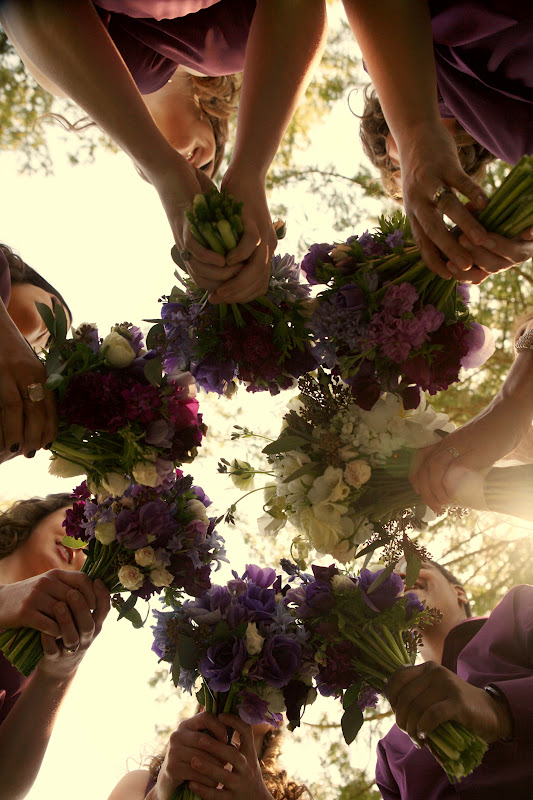 Bridesmaids holding bouquets in a circle