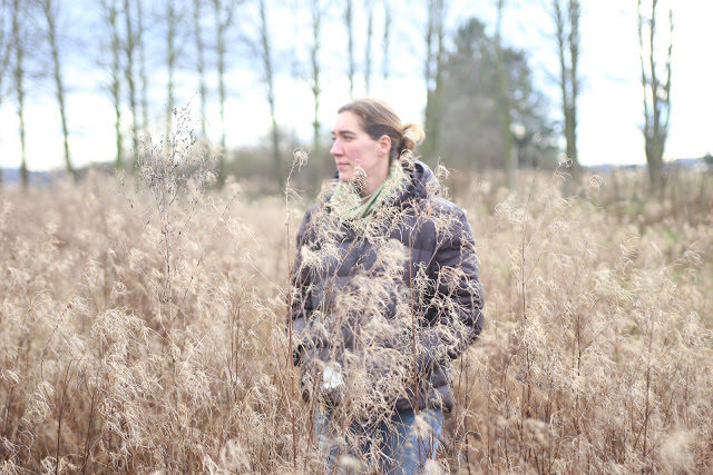 Erin Benzakein in a field of grass