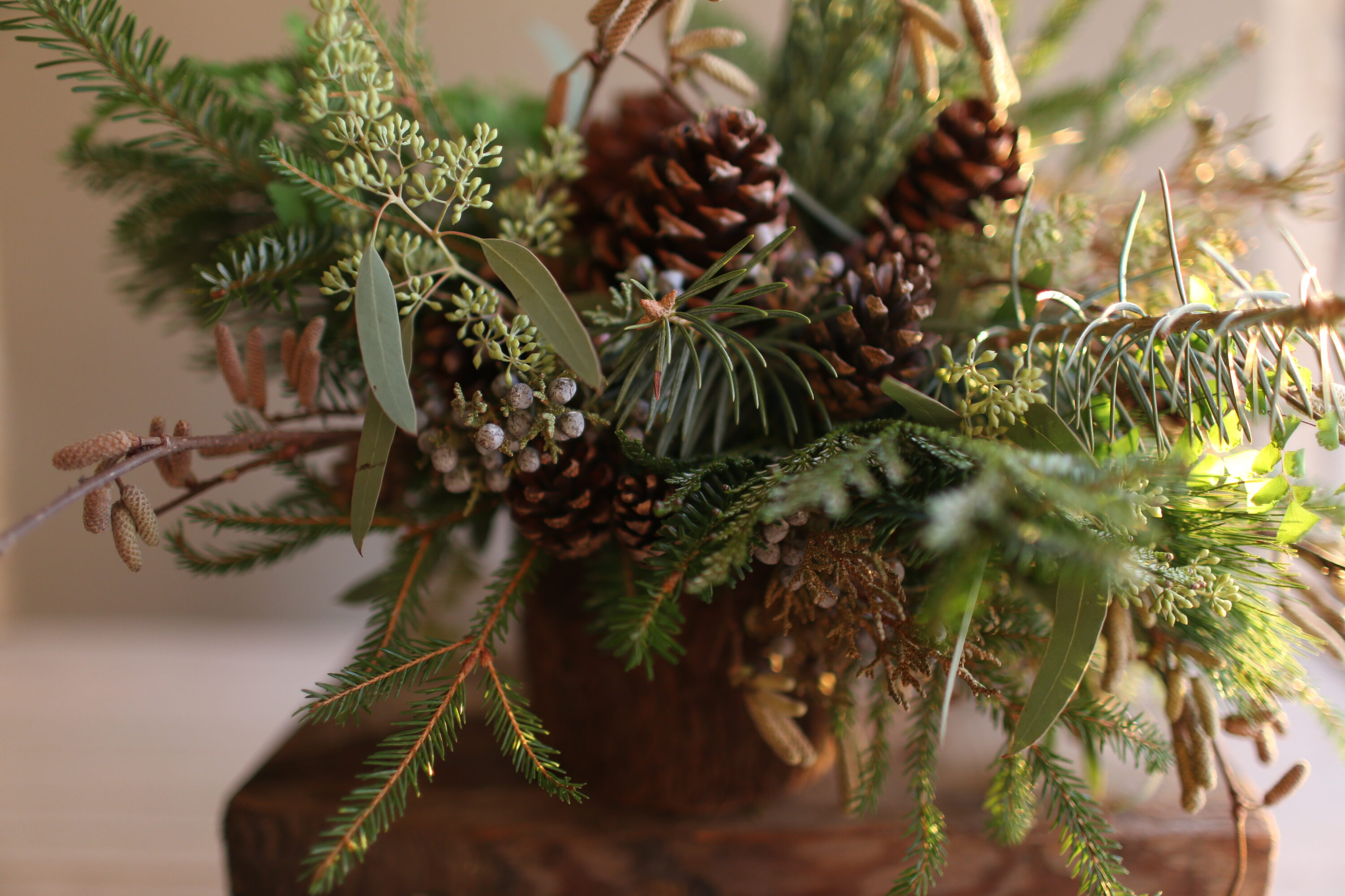 A seasonal bouquet with pinecones