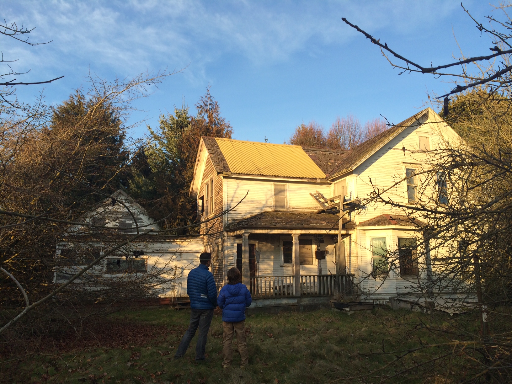 Chris and Jasper Benzakein in front of an old house