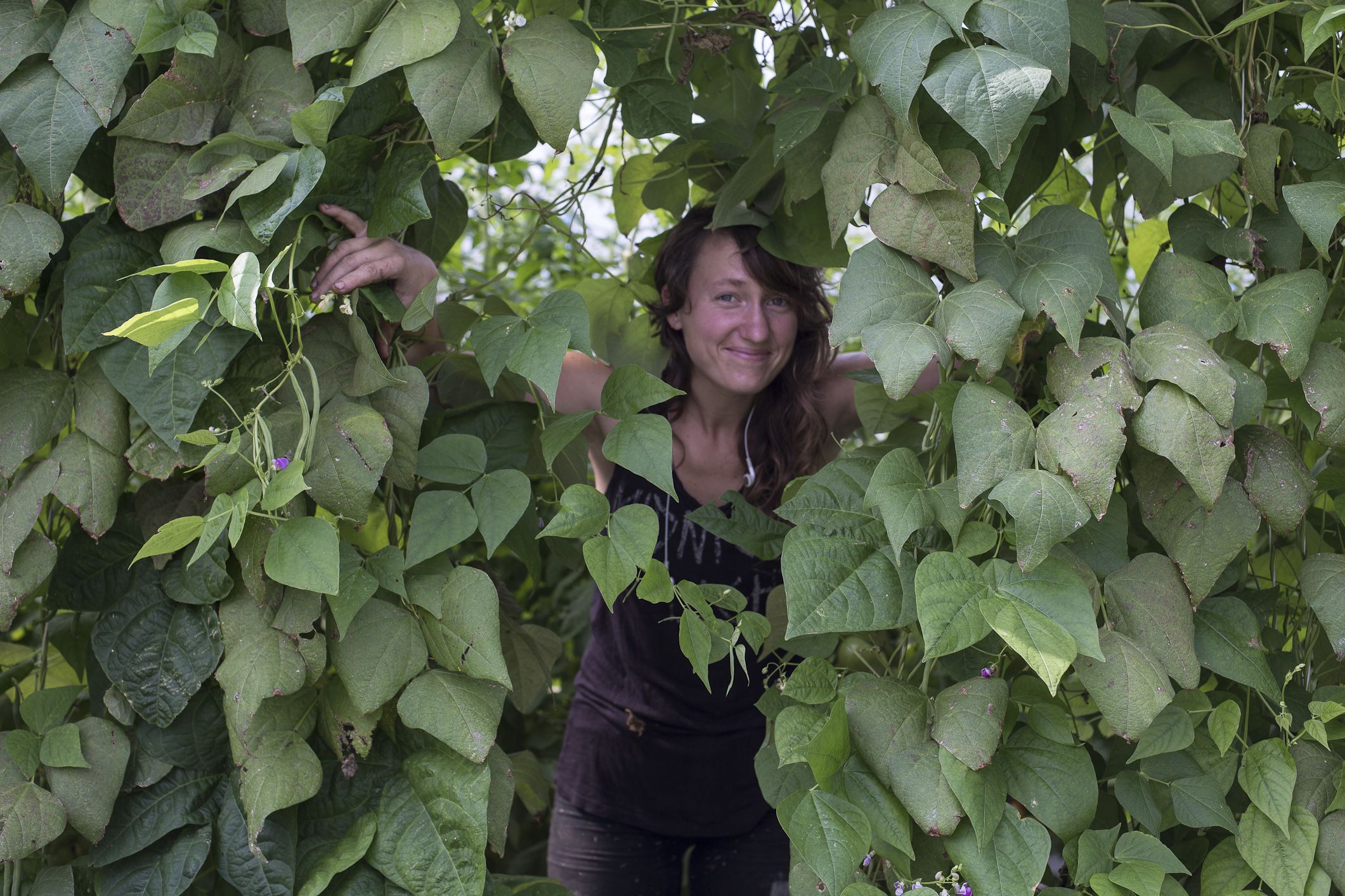 A woman surrounded by vines
