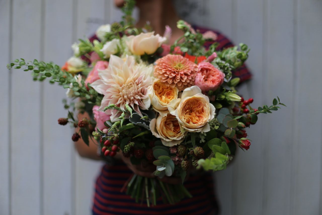 A person holding a bouquet