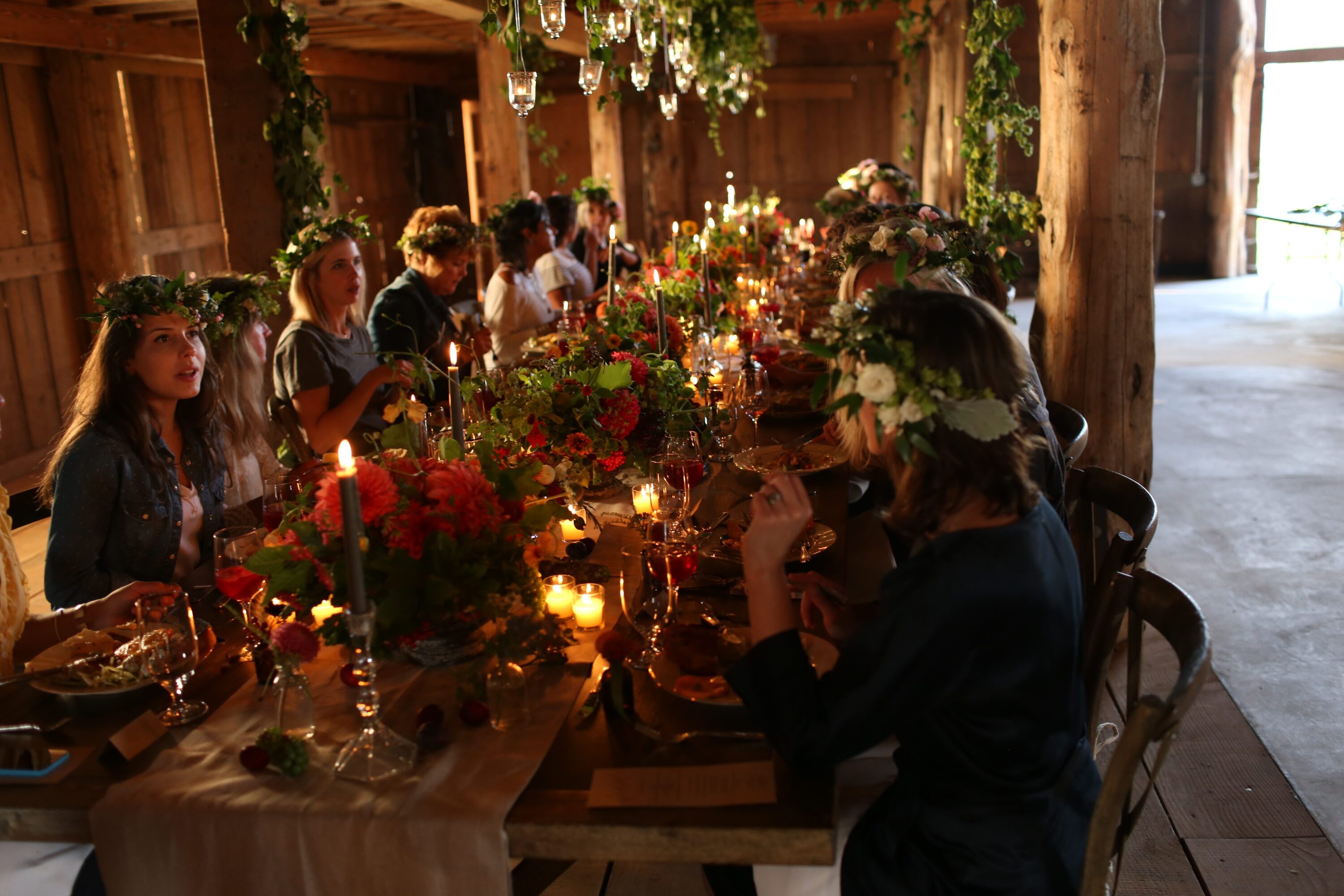 People dining at a table decorated with flowers