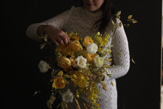 A person holding a bouquet