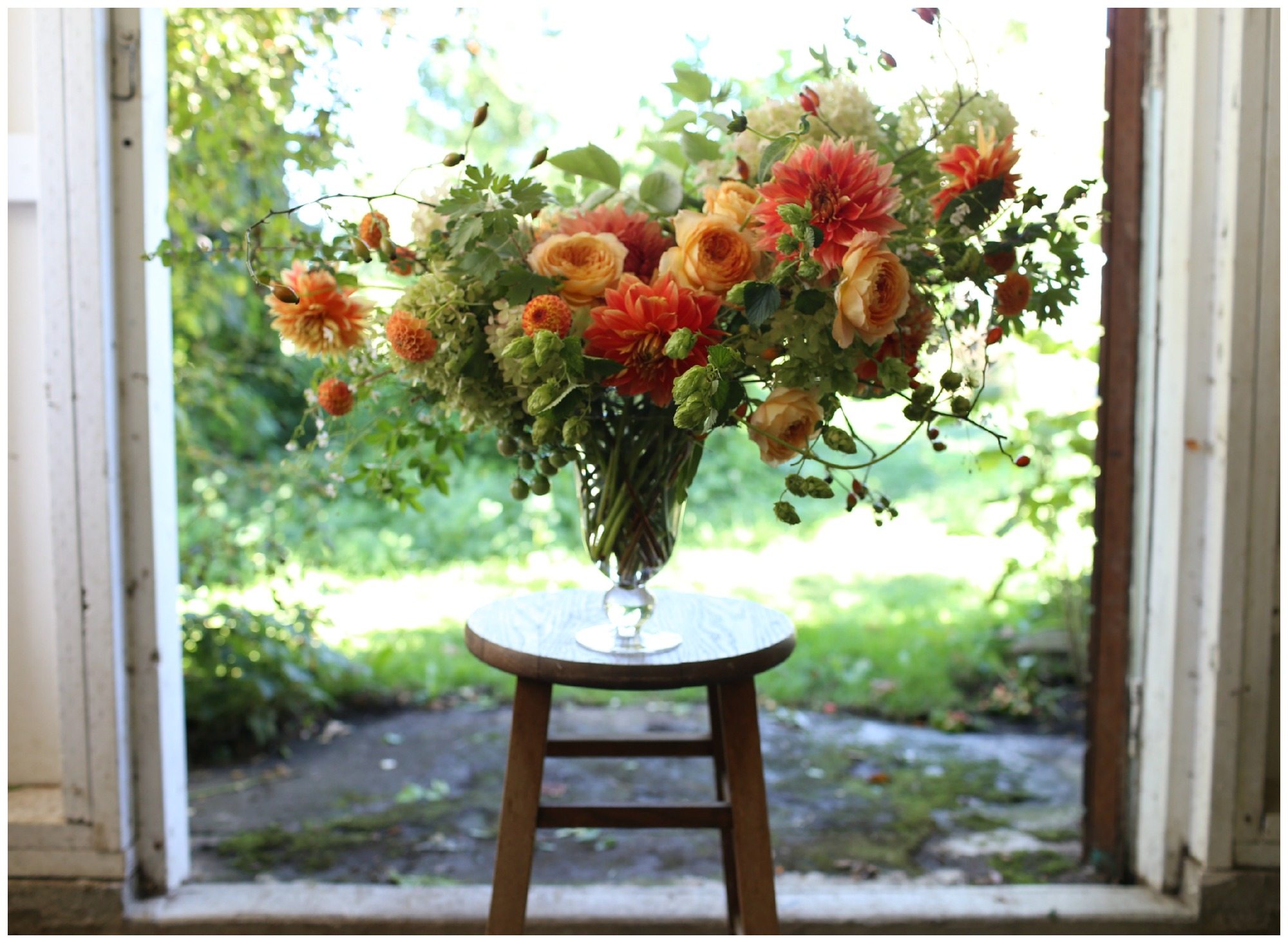A flower arrangement on a stool