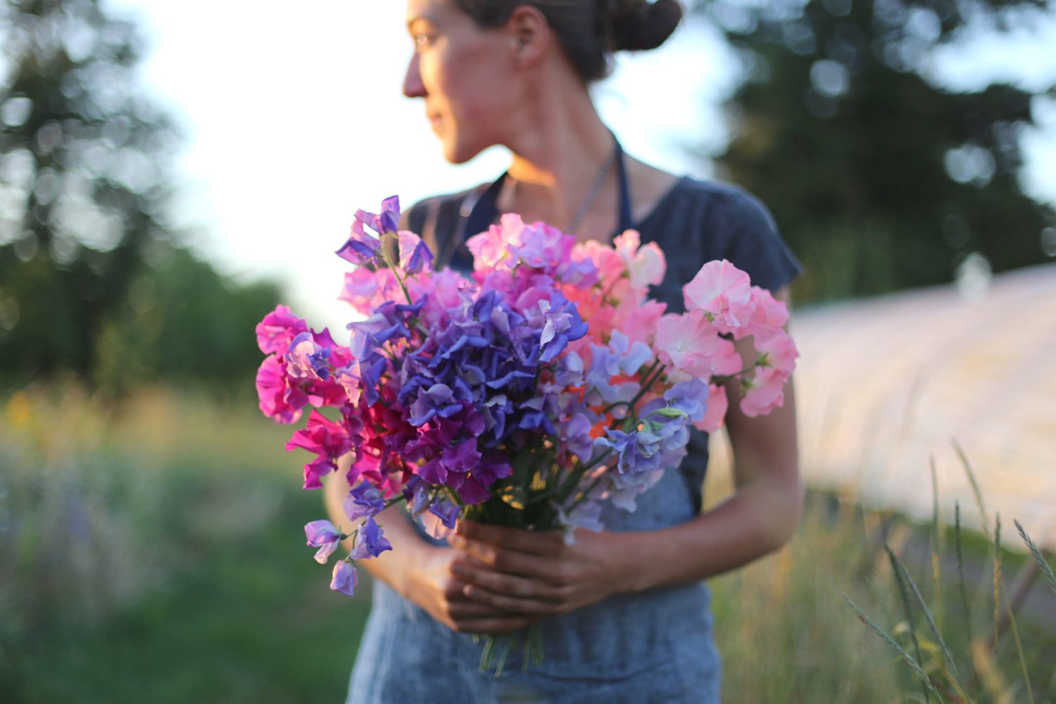 Erin Benzakein holding a bouquet of sweet peas