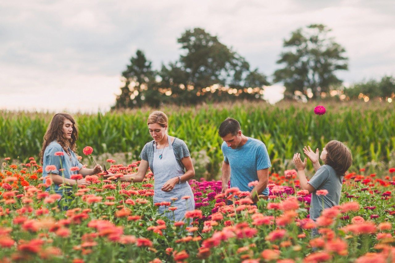 The Benzakein family in a field of zinnias