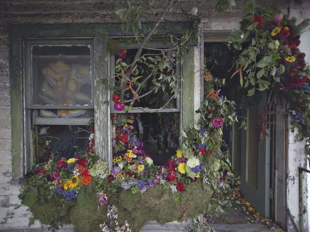 The exterior of a house decorated with flowers