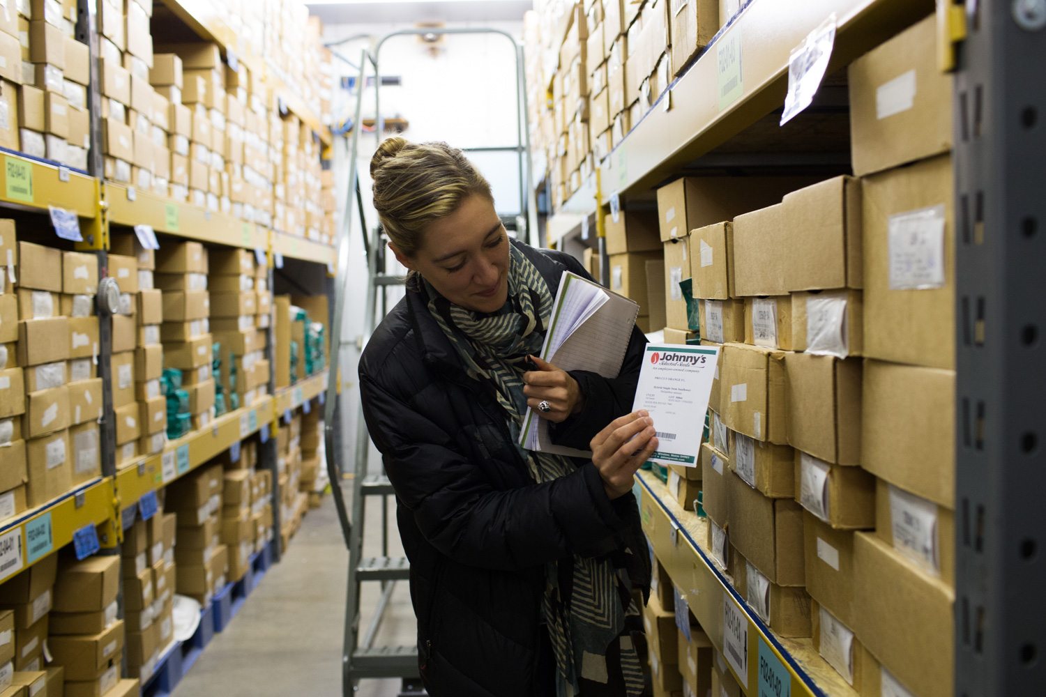 Erin Benzakein surrounded by shelves of flower seed