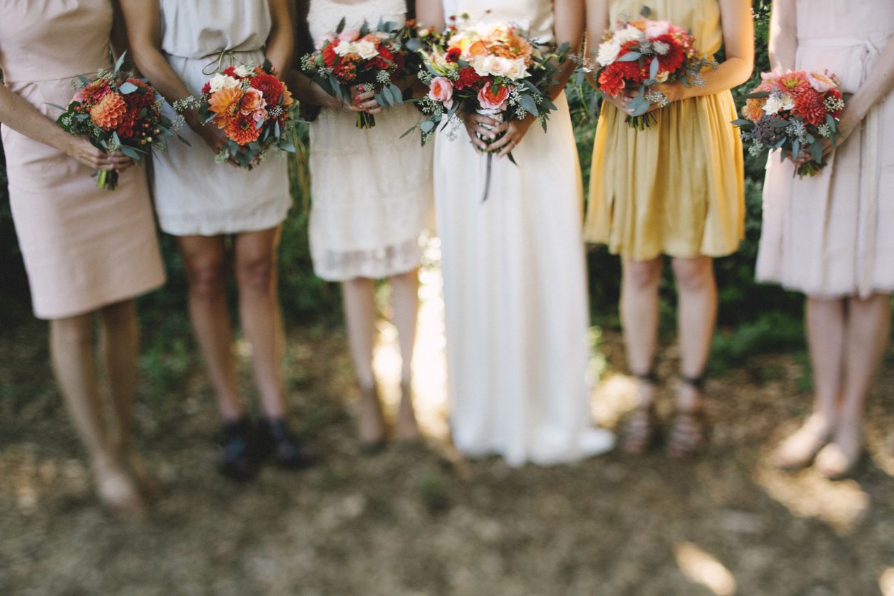 A bride and bridesmaids holding bouquets