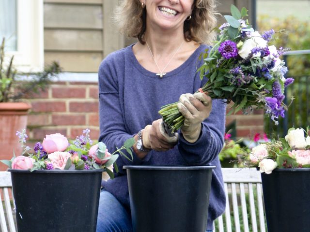 Rosebie Morton arranging bouquets
