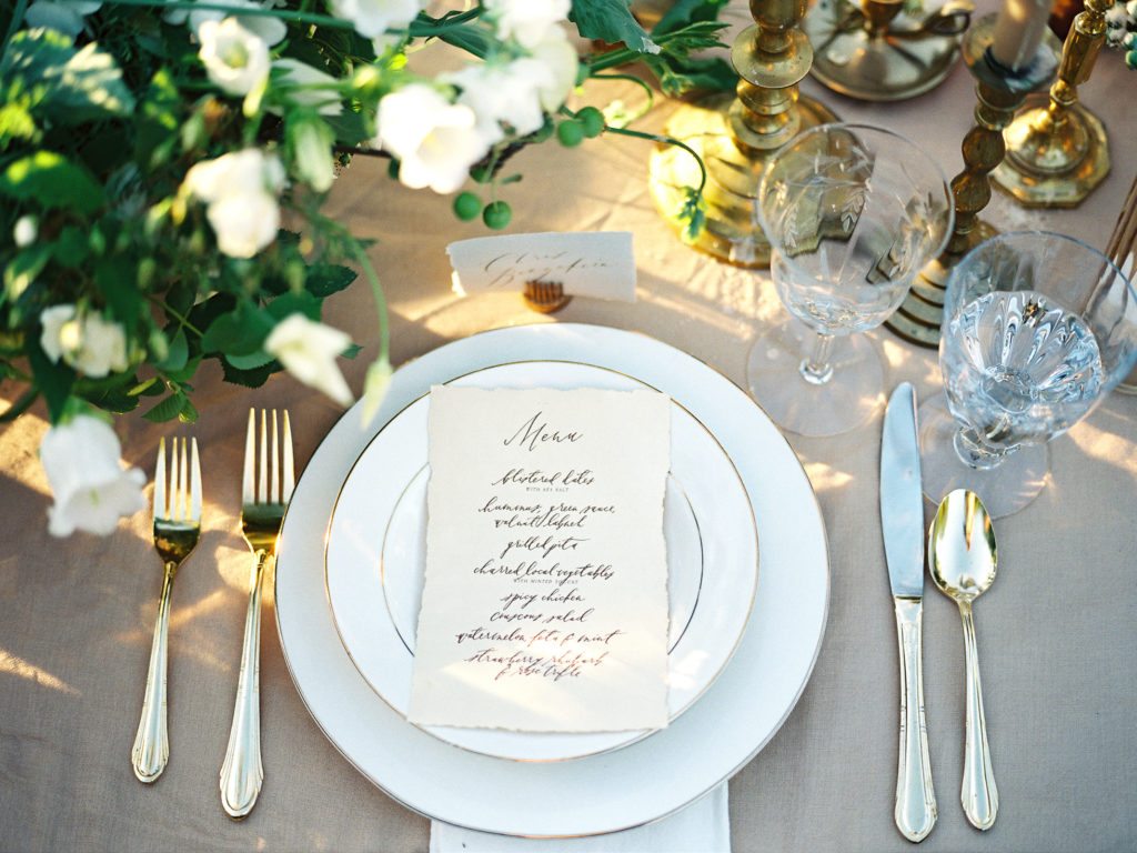 A place setting with a handwritten menu