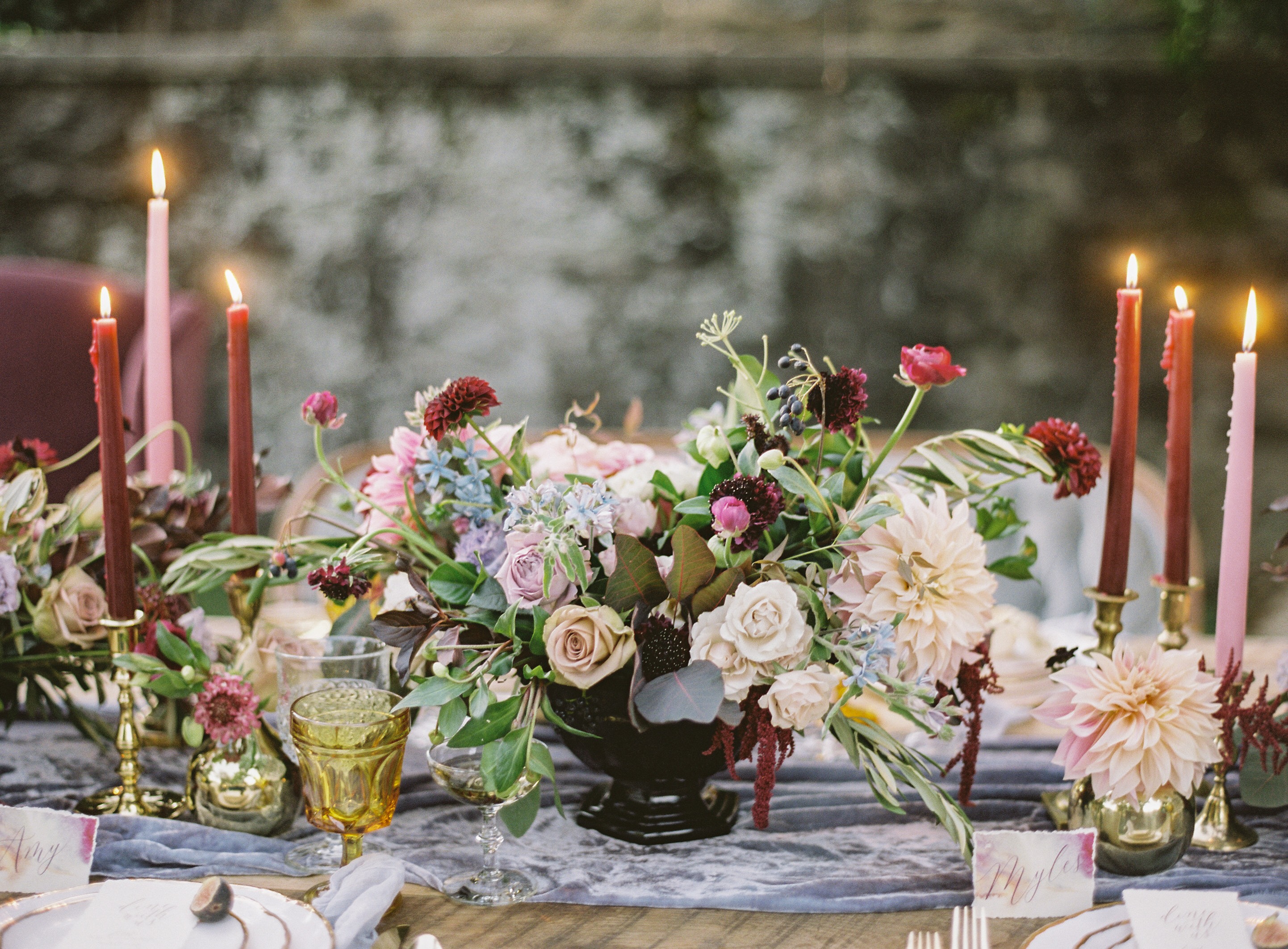 A flower arrangement on a dinner table