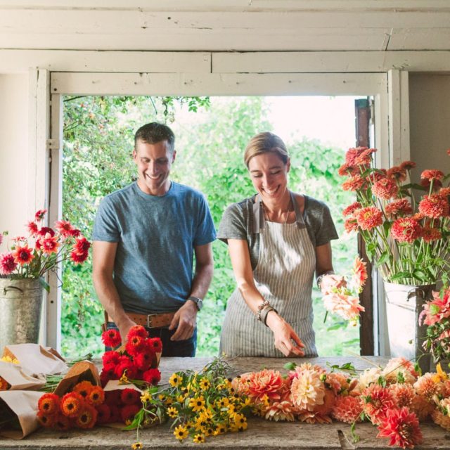 Erin and Chris Benzakein arranging flowers in the Floret studio
