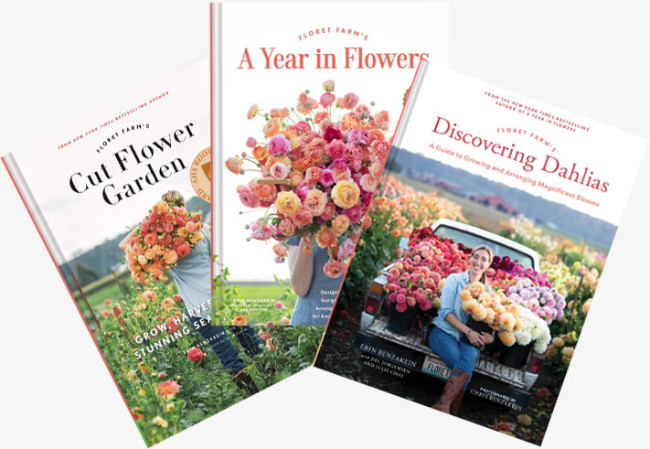 Chris and Erin Benzakein of Floret sorting cut flowers of many colors on a wooden work bench