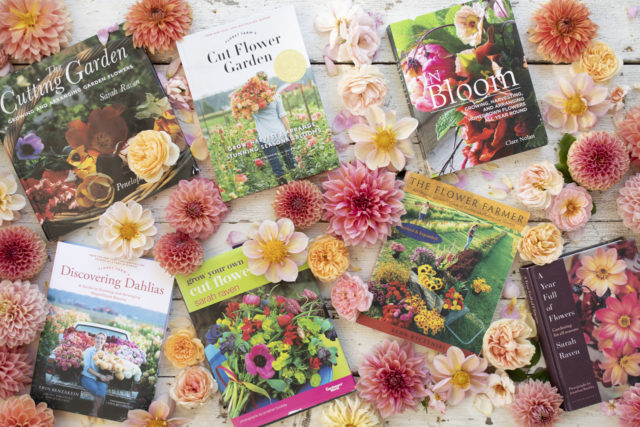 Overhead of Floret's favorite books surrounded by dahlias