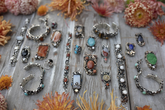 Overhead of Floret's favorite jewelry surrounded by mums