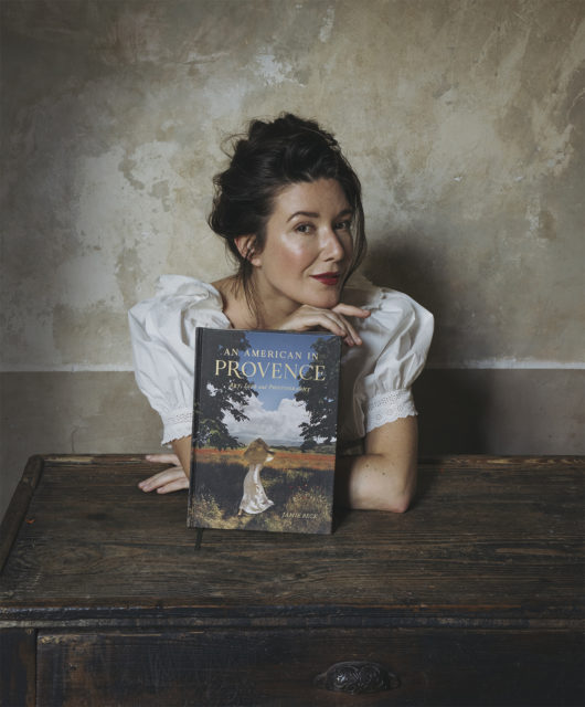 Jamie Beck poses with her book An American in Provence