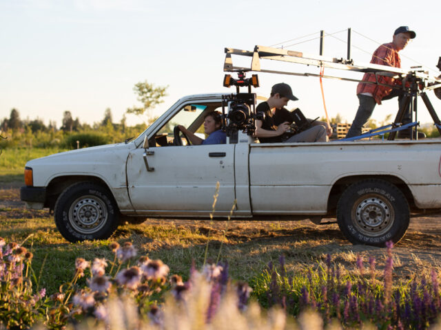 Jill Jorgensen driving the Floret truck with the film crew and camera in the back