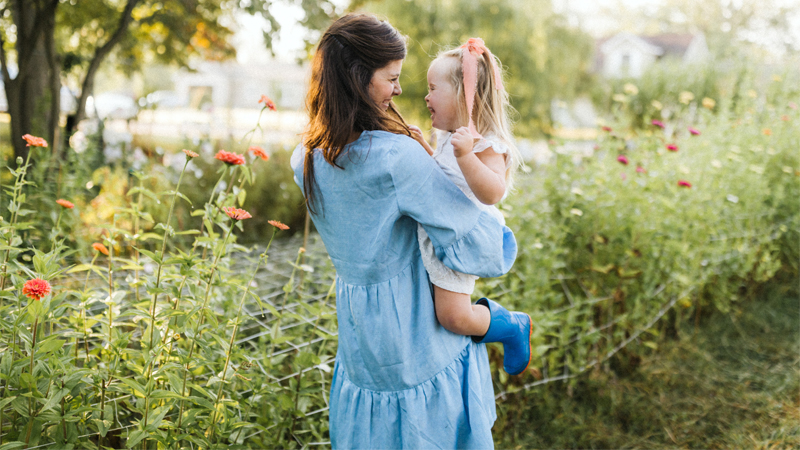 Danielle Grandholm and her daughter in their garden