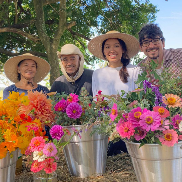Renata Ninello and her family with buckets of blooms