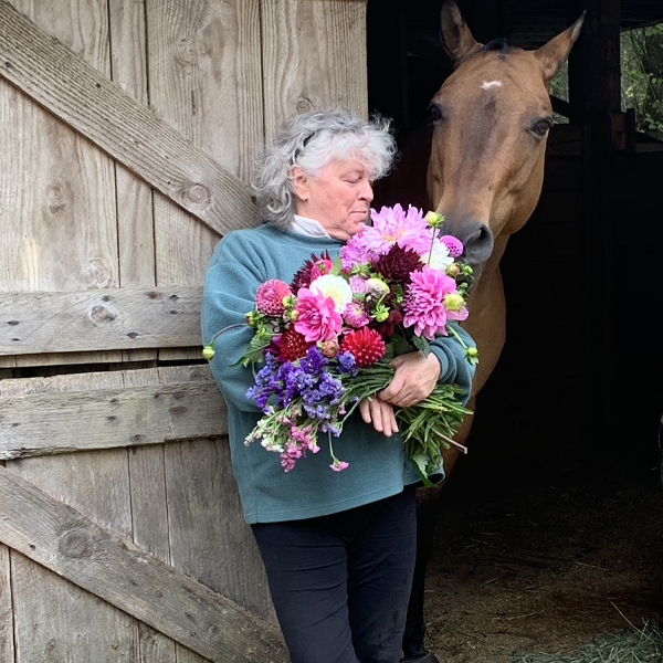 Sue Cambridge with an armload of blooms
