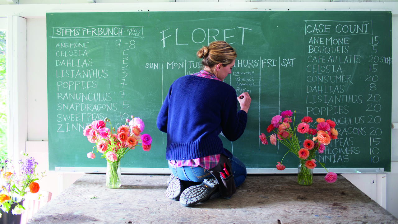 Erin Benzakein writing on a chalkboard