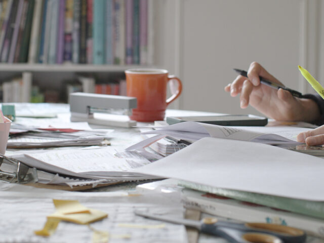 Erin Benzakein surrounded by supplies while she plans the farm