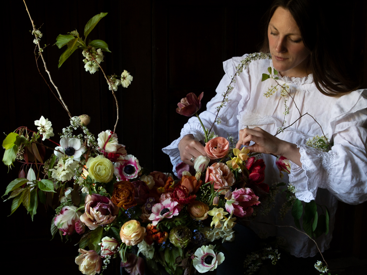 Milli Proust creating a floral arrangement