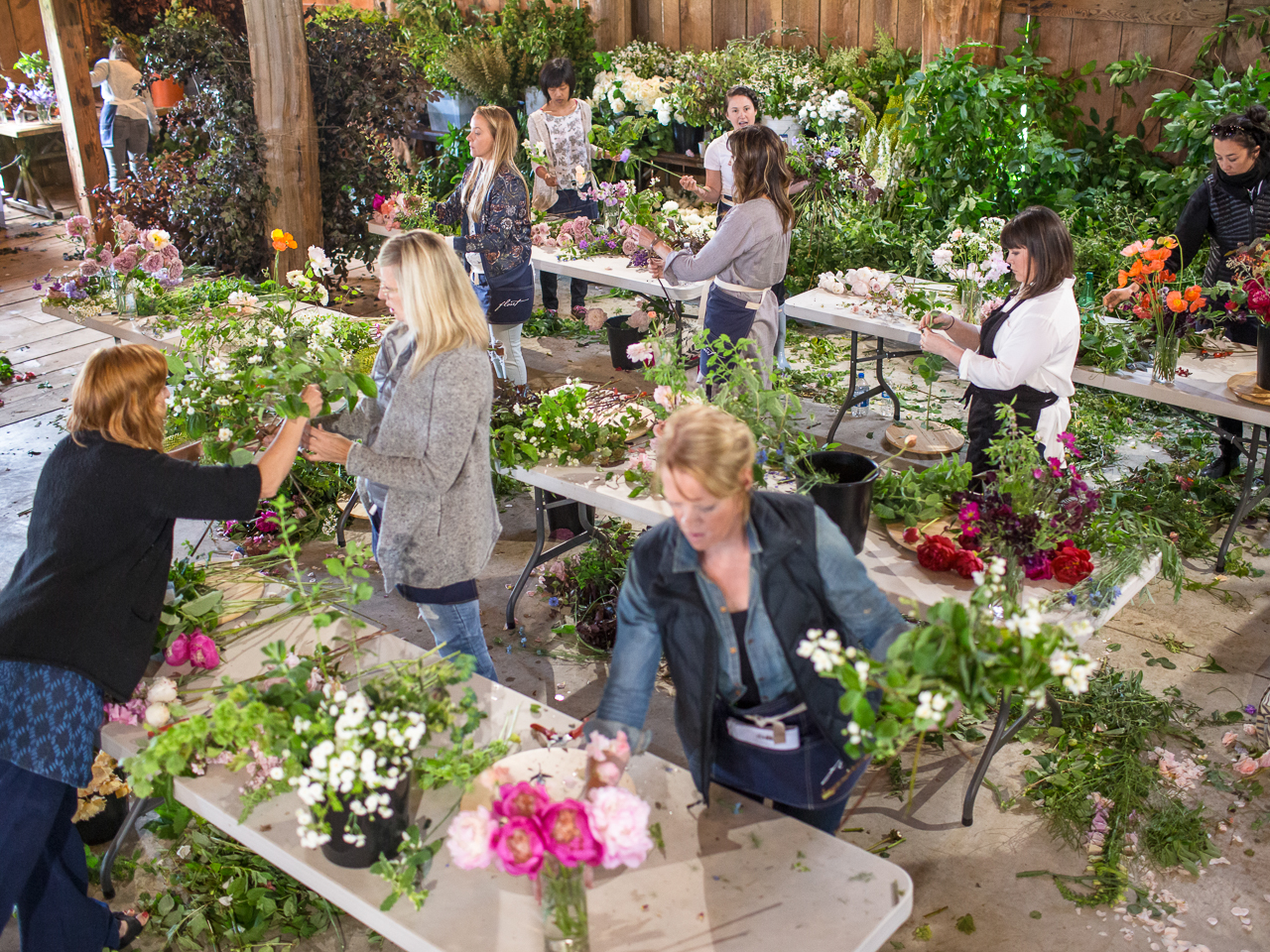 Floret workshop students creating floral arrangements