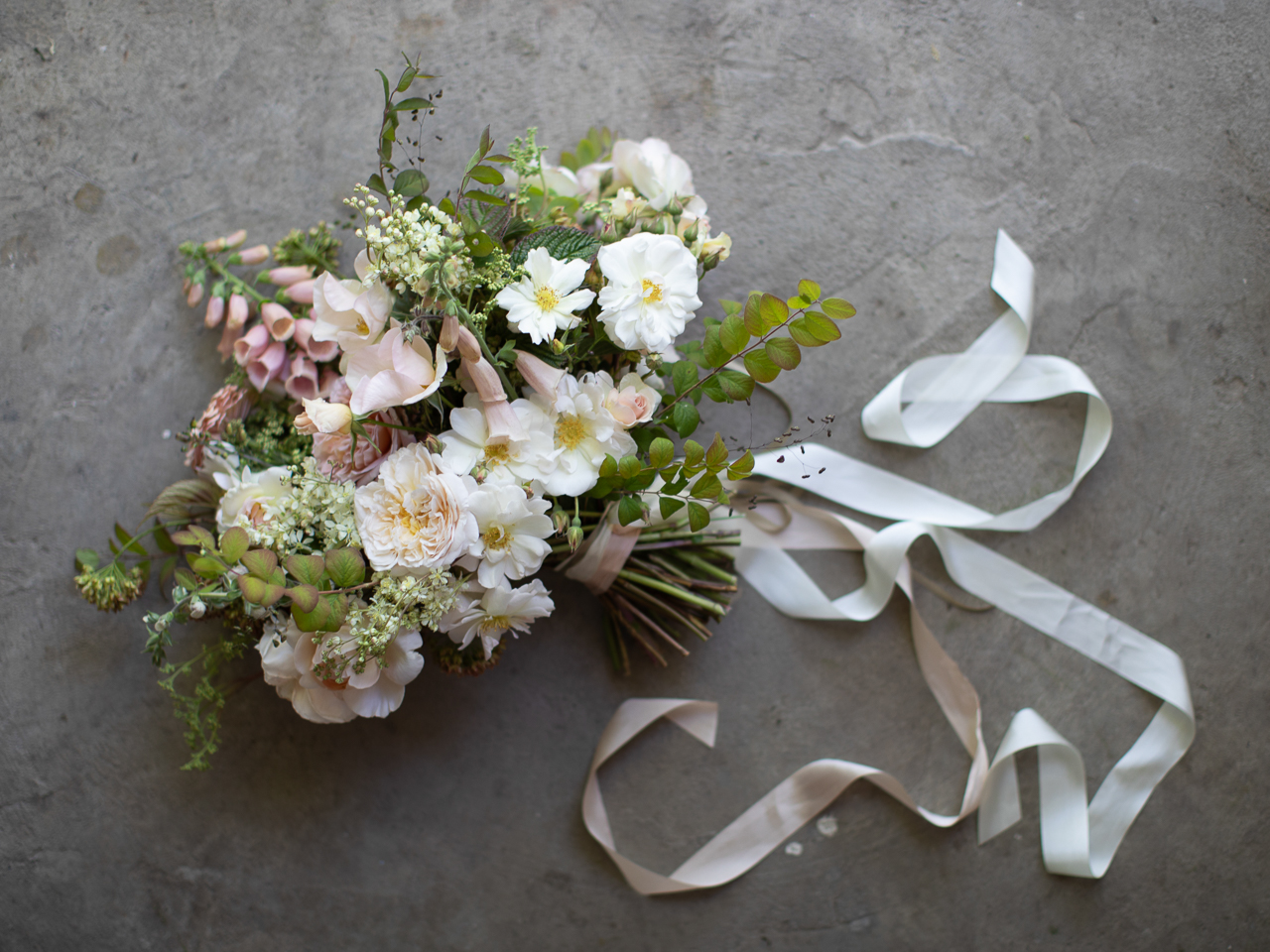 Overhead of bridal bouquet with ribbon treatment