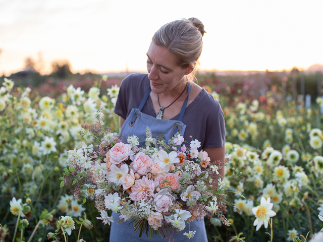 Erin Benzakein holding a bouquet she created with seasonal blooms