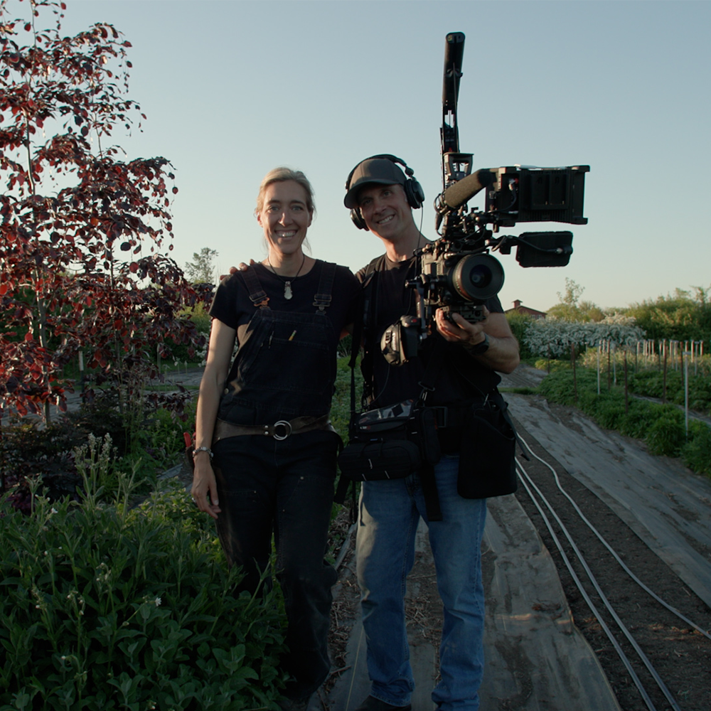 Erin & Chris Benzakein in the cutting garden at Floret with their film gear