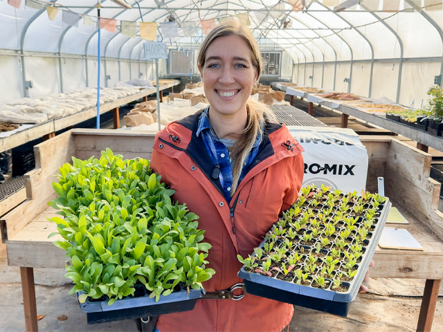 Erin Benzakein holding seedling trays with Floret potting soil experiment results