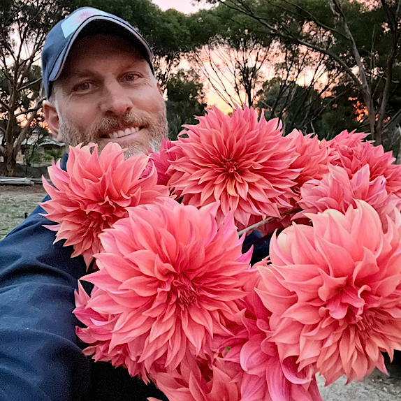 Wade Kingsley with an armload of dahlias